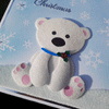 A Christmas card showing a baby polar bear made from flock 