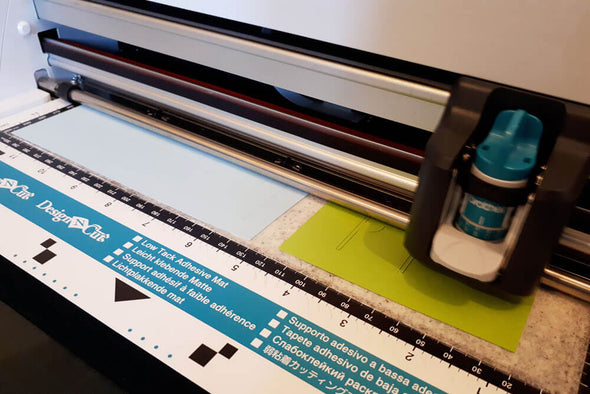 Card covered in Sticky Roll being cut on a Scan N Cut CM900